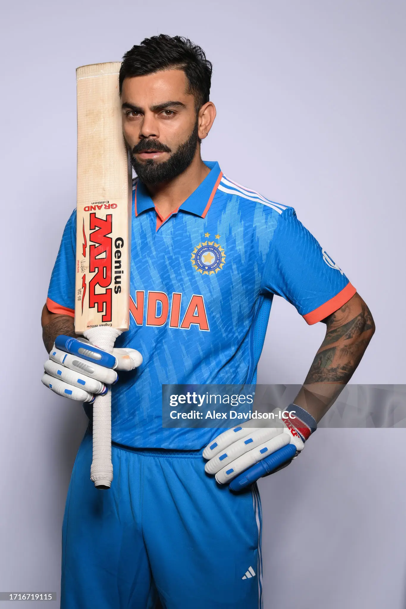 Virat Kohli in documentary silhouette under stadium floodlights